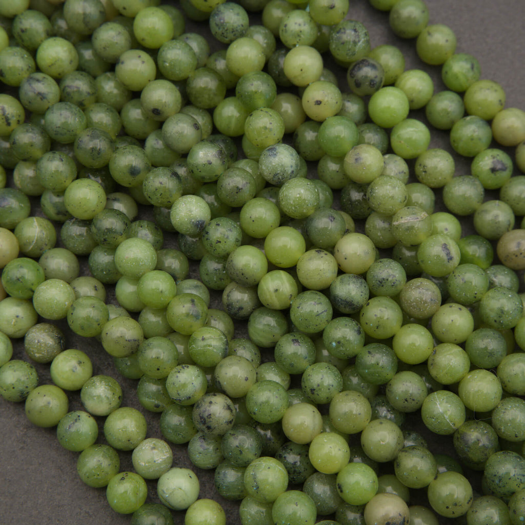 Round light green jade beads.