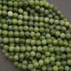Round light green jade beads.