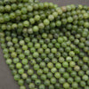 Round light green jade beads.