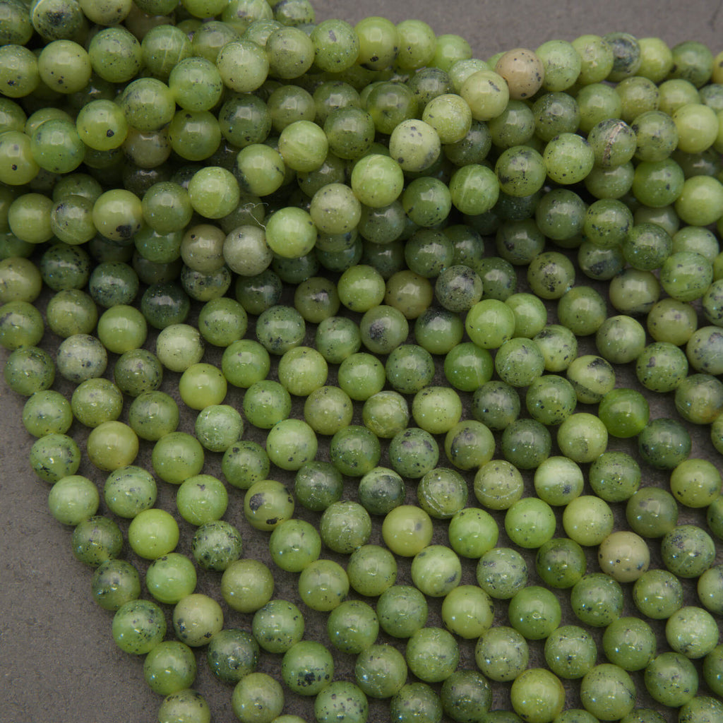 Round light green jade beads.