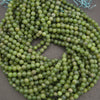 Round light green jade beads.