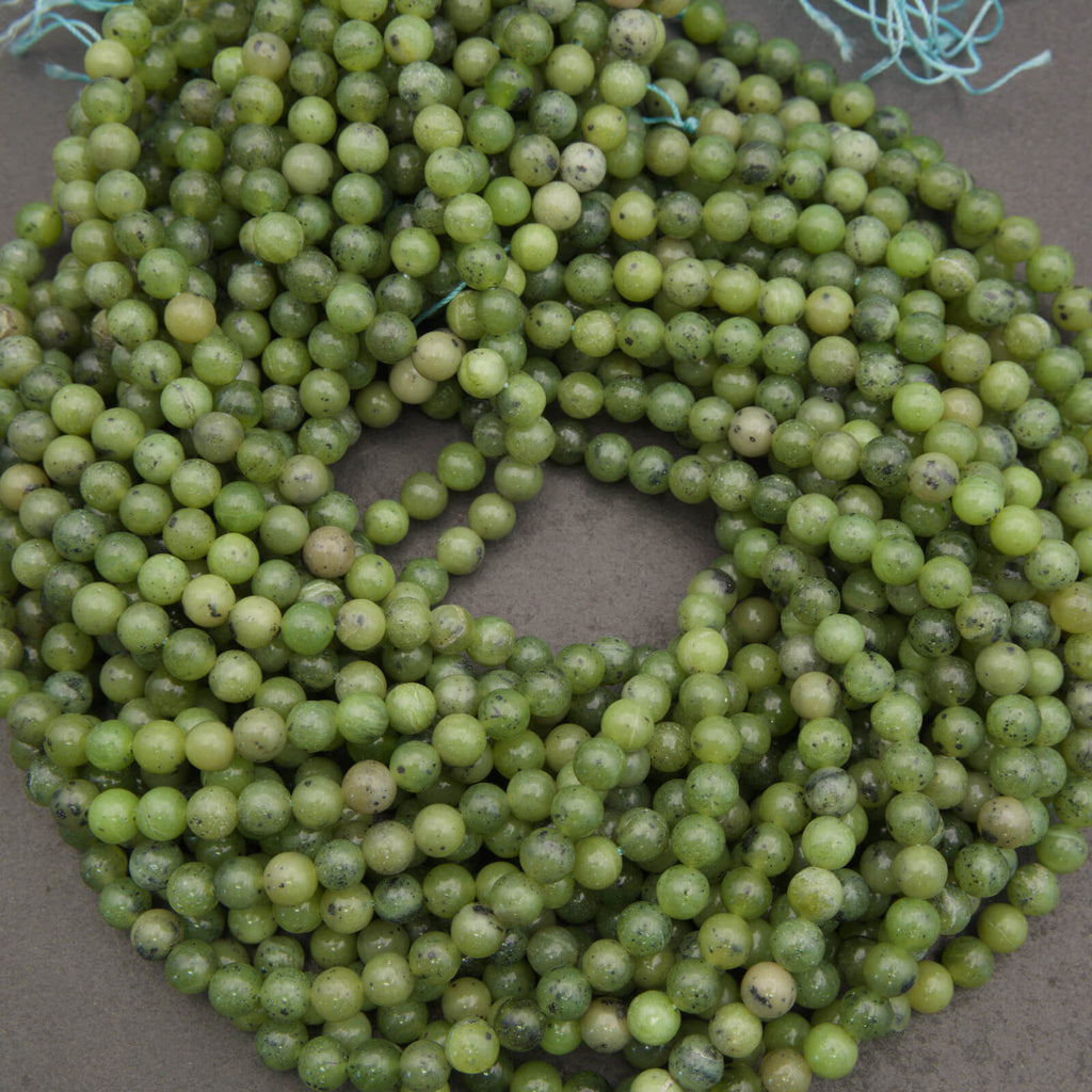 Round light green jade beads.
