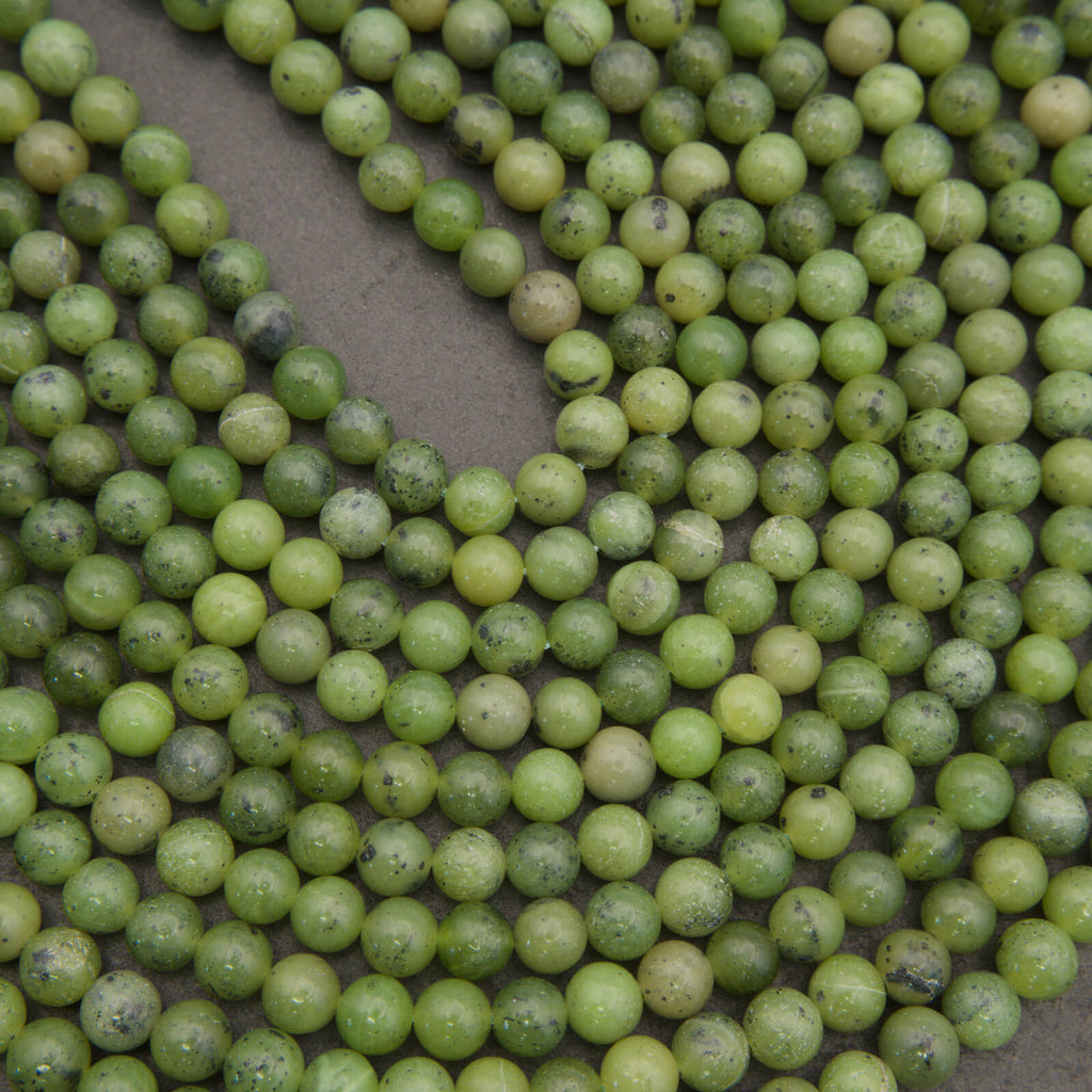 Round light green jade beads.
