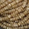 Close-up of a pile of yellow beads