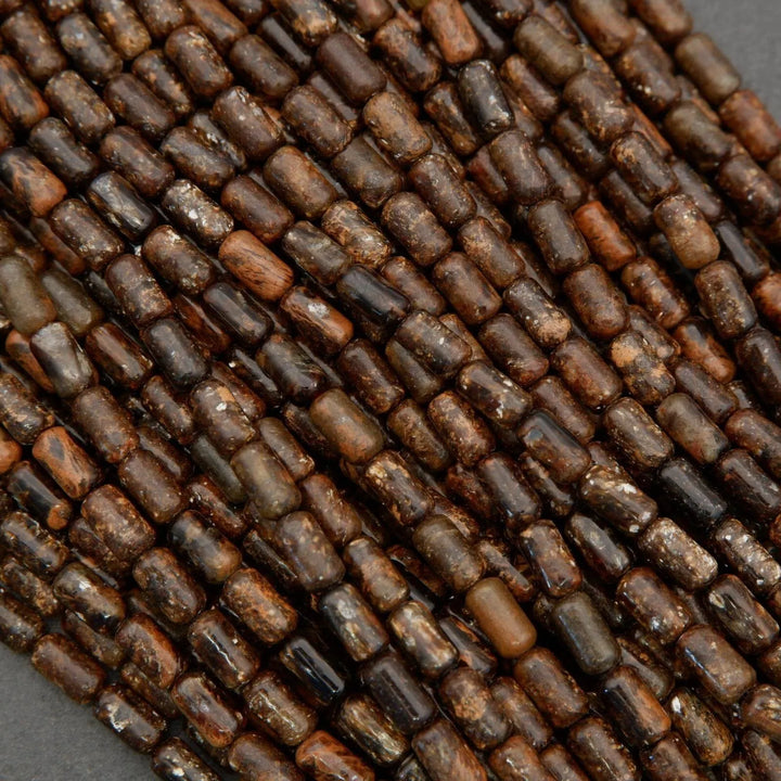 Close-up of brown glass beads on a gray background