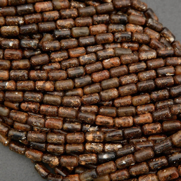 Close-up of brown cylindrical beads on a gray background