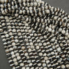 Close-up of black and white beads on a gray background