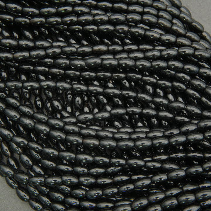 Black onyx spacer beads oval shape high polish deep black color