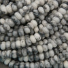 Close-up of white and gray marbled beads