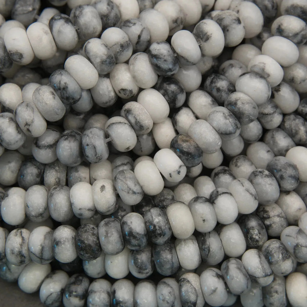 Close-up of white and gray marbled beads