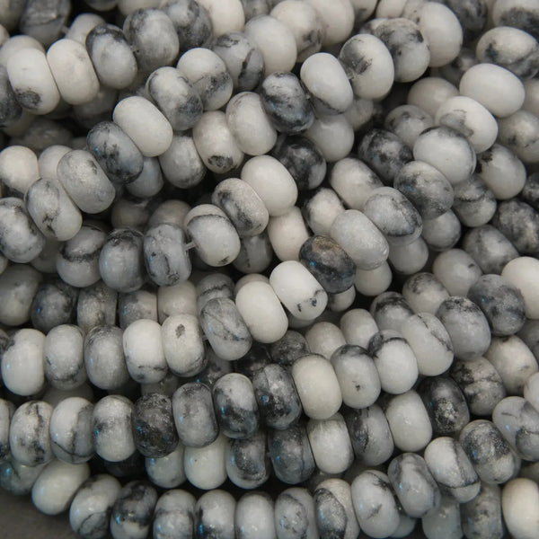 Close-up of white and gray marbled beads