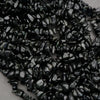Close-up of black pebbles on a white background