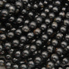 Black Tourmaline round beads with a glossy polished finish and natural mineral inclusions