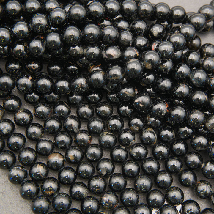 Glossy Black Tourmaline round beads with subtle natural color variation