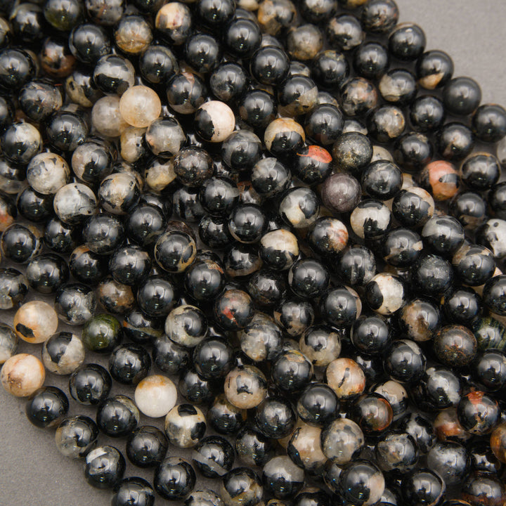 Strands of Black Tourmaline in Quartz beads with dramatic mineral inclusions