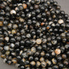 Black and cream Tourmaline in Quartz beads with varied natural patterns
