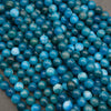 A heap of smooth round blue apatite bead strands in teal, ocean blue and sky blue