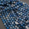 Strands of smooth round blue aventurine beads with Tejas Beads size tags