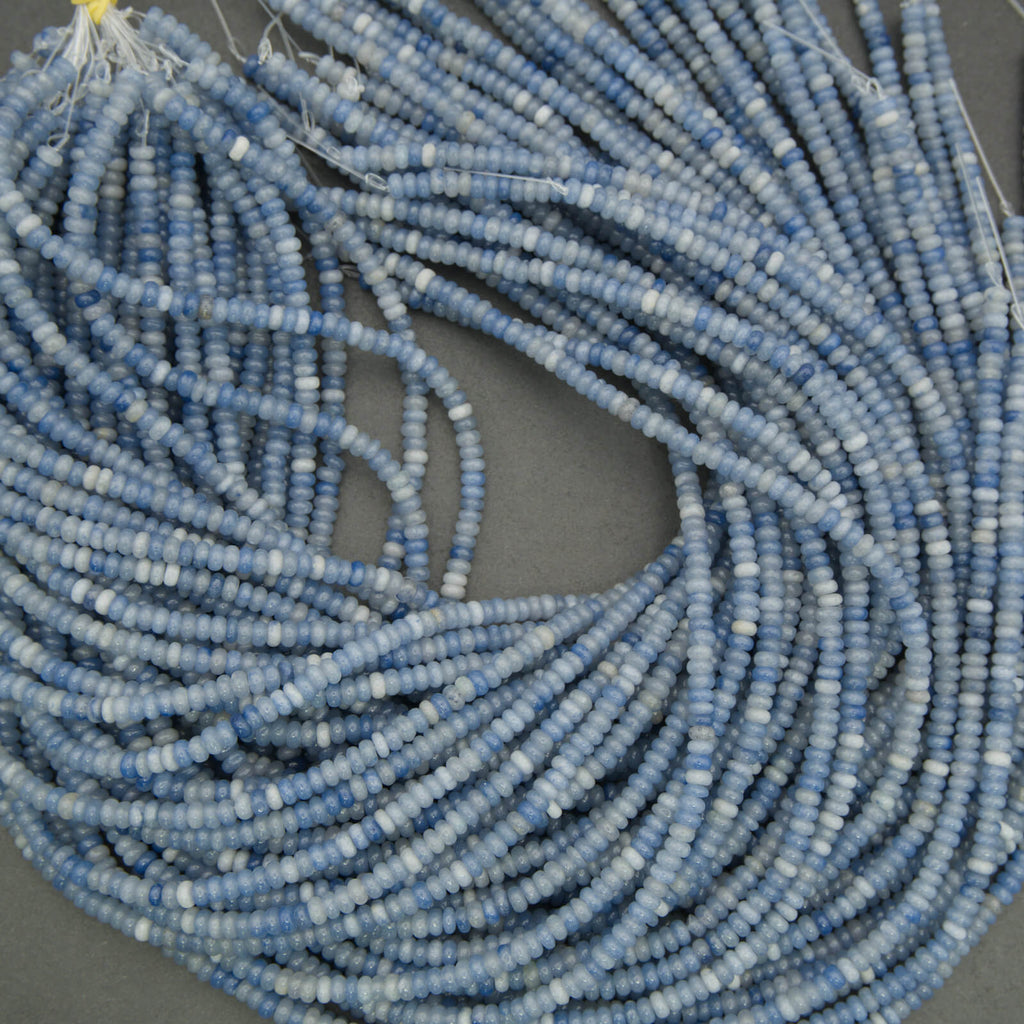 Blue aventurine rondelle beads close up showing natural variation