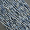 Close-up of blue beads on a gray background