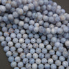 Close-up of blue marbled beads on a dark background