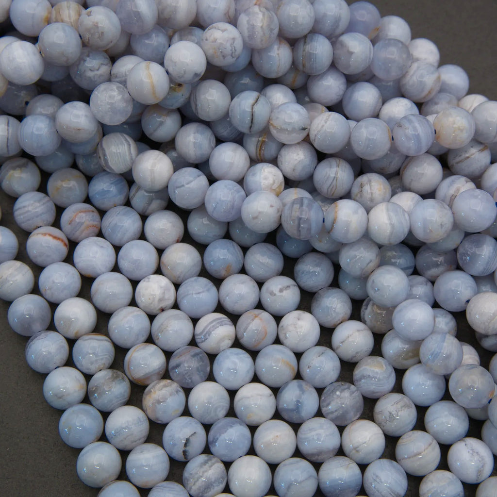 Close-up of blue marbled beads on a dark background