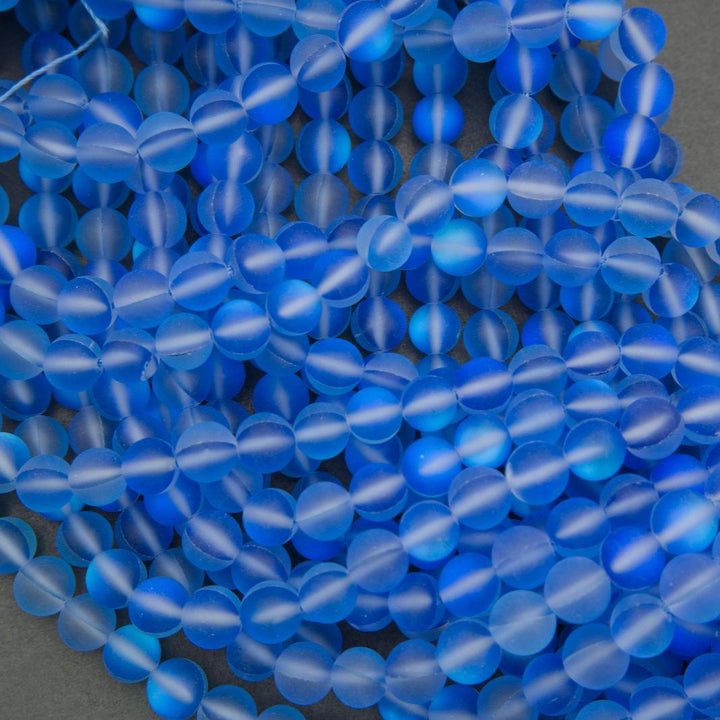 Close-up of blue beads on a gray background