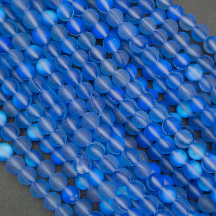 Close-up of blue beads on a dark background