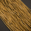 Handcrafted brass tube beads, elongated and slightly irregular with natural golden luster