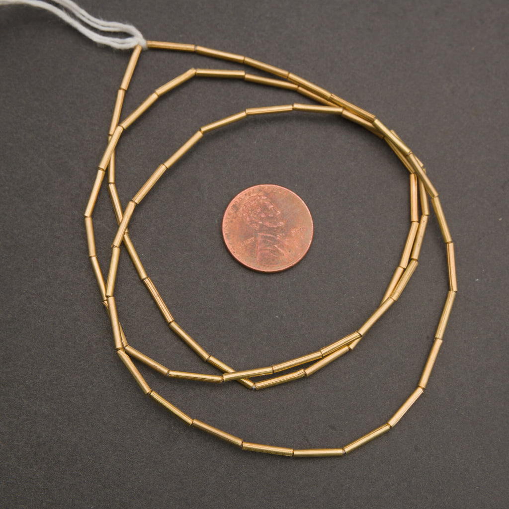 African brass tube beads, narrow cylinders with organic variation and soft metallic sheen