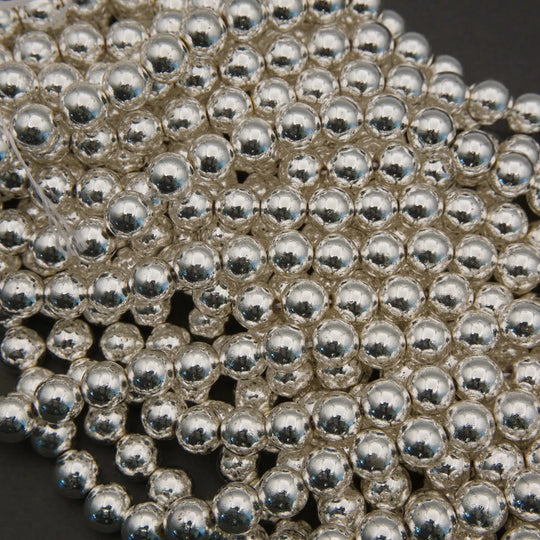Close-up of silver metal balls on a dark background