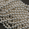 Close-up of silver metal balls on a dark background