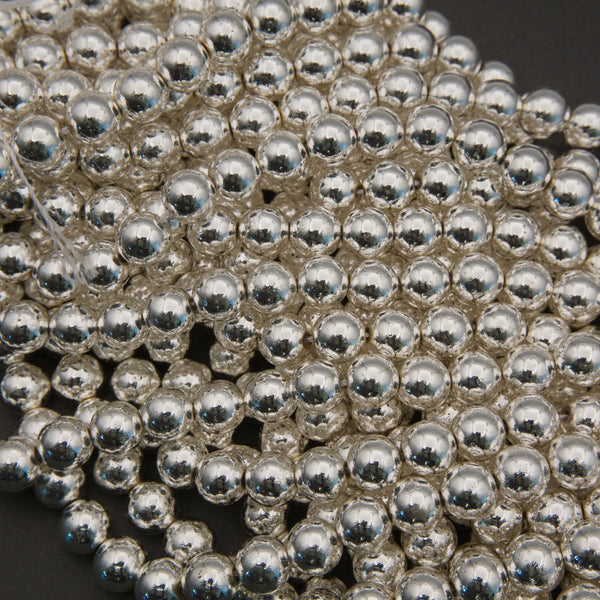 Close-up of silver metal balls on a dark background