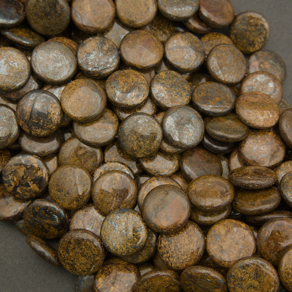 Close-up of a pile of rusted metal buttons