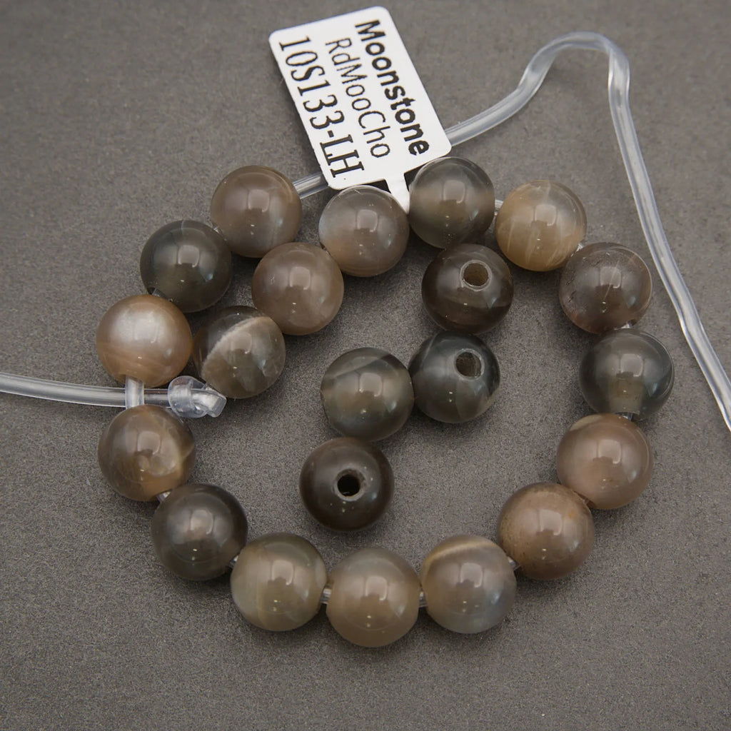 String of brown beads with a label on a gray background