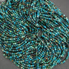 Close-up of a string of blue and green beads on a gray background