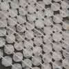 Faceted clear quartz octagon beads with icy white tones, translucent surfaces, and silver spacers.