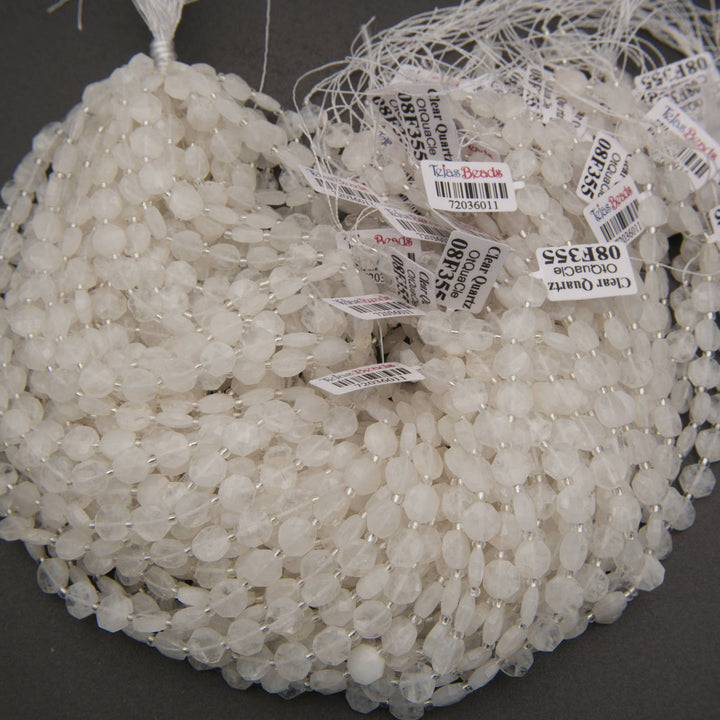 Translucent white quartz octagon beads with sparkling facets and natural cloudy inclusions.