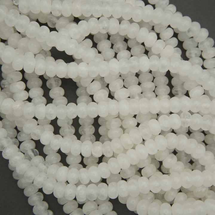 Close-up of white beads on a dark background