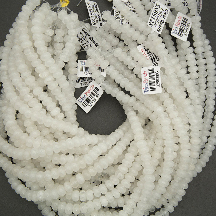White beads with barcodes on a dark background