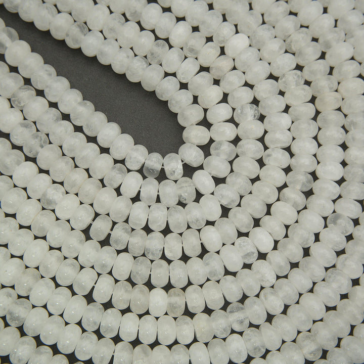 Close-up of white quartz beads on a black background