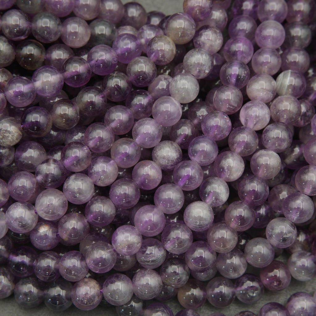 Close-up of purple beads on a gray background