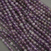 Close-up of purple pearls on a gray background