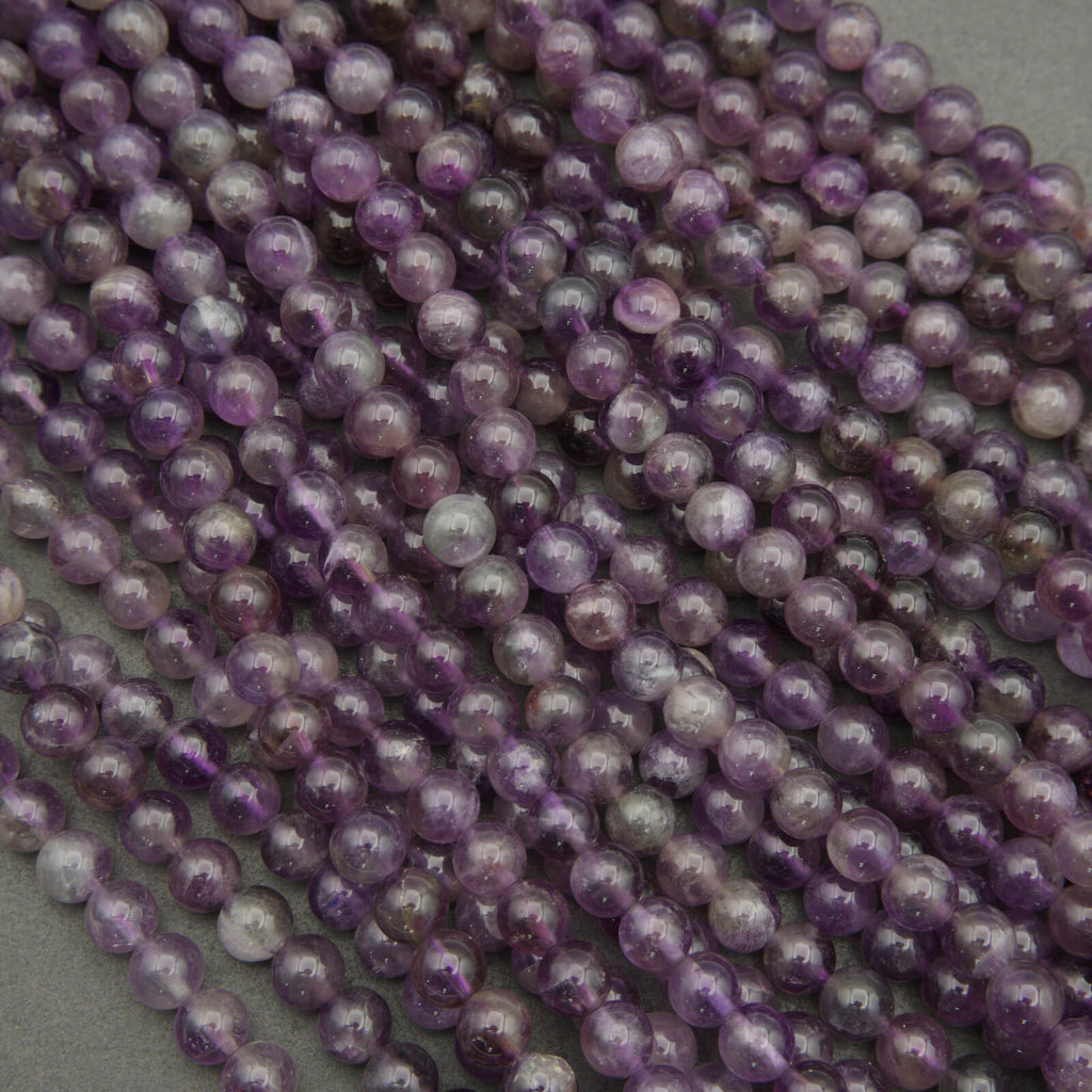 Close-up of purple pearls on a gray background