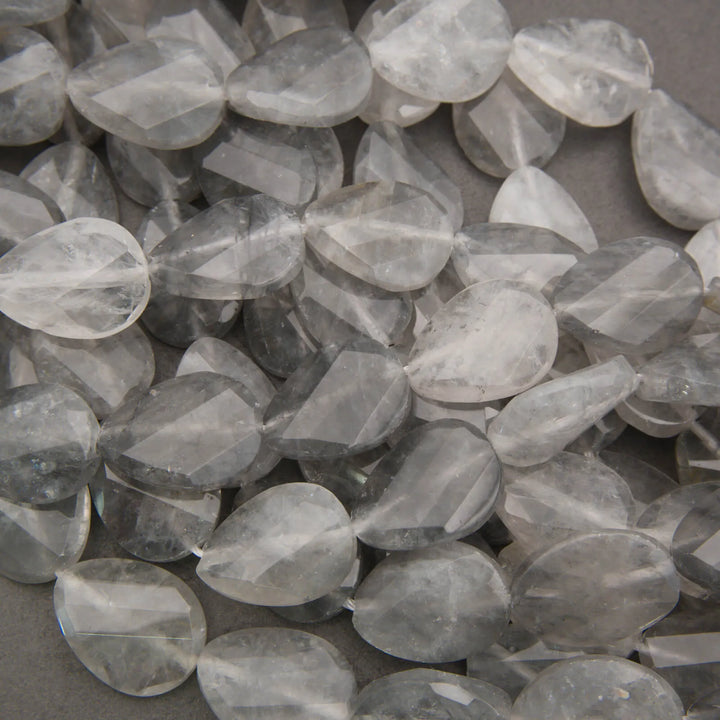 Cloudy clear twisted oval beads.