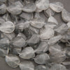 Cloudy clear twisted oval beads.