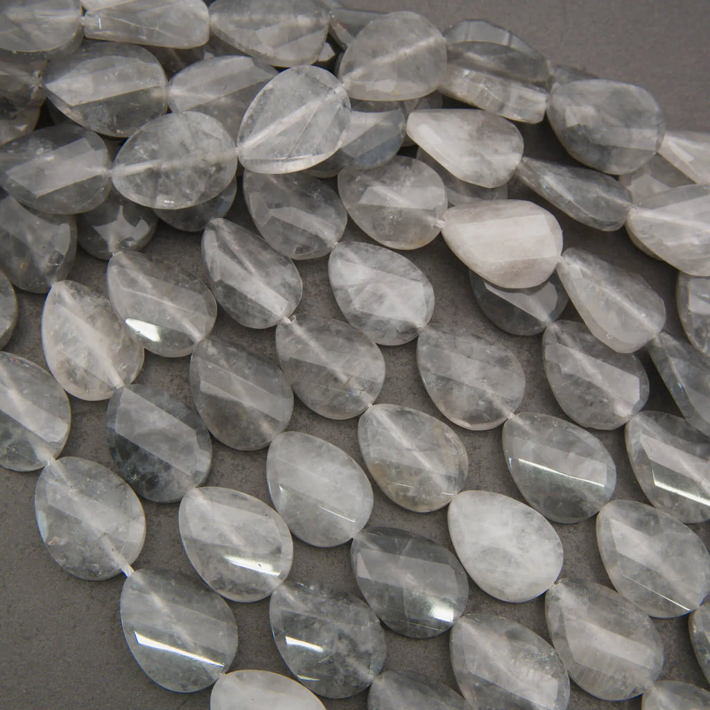 Cloudy clear twisted oval beads.