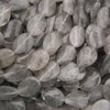 Cloudy clear twisted oval beads.