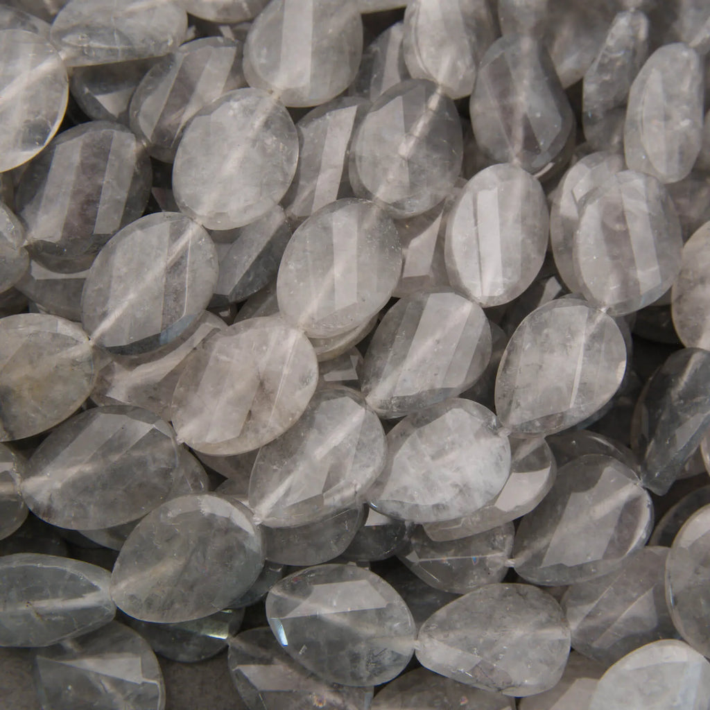 Cloudy clear twisted oval beads.