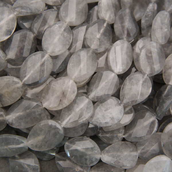 Cloudy clear twisted oval beads.